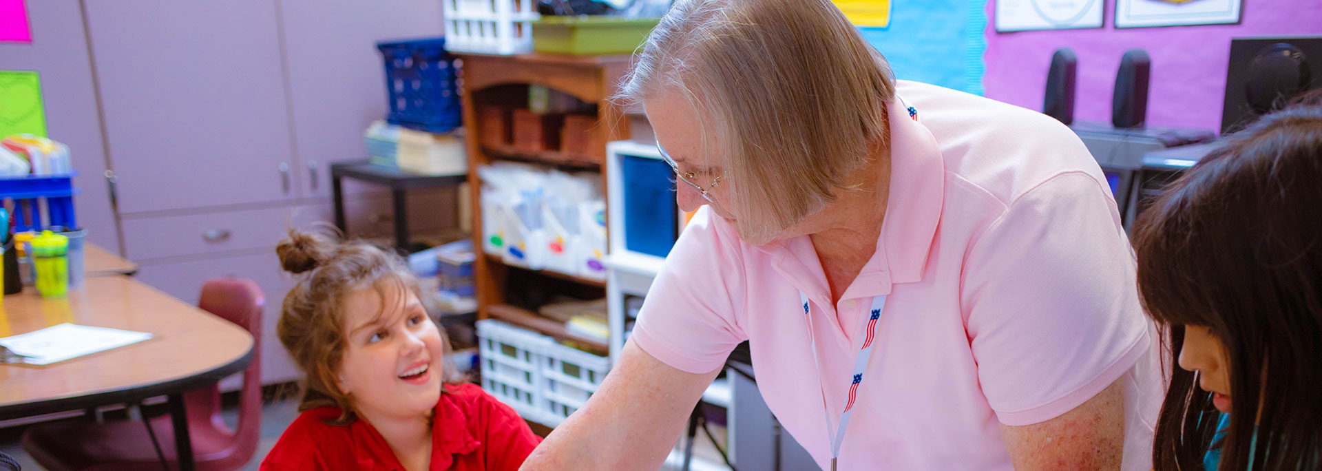 
		A teacher helping a student		