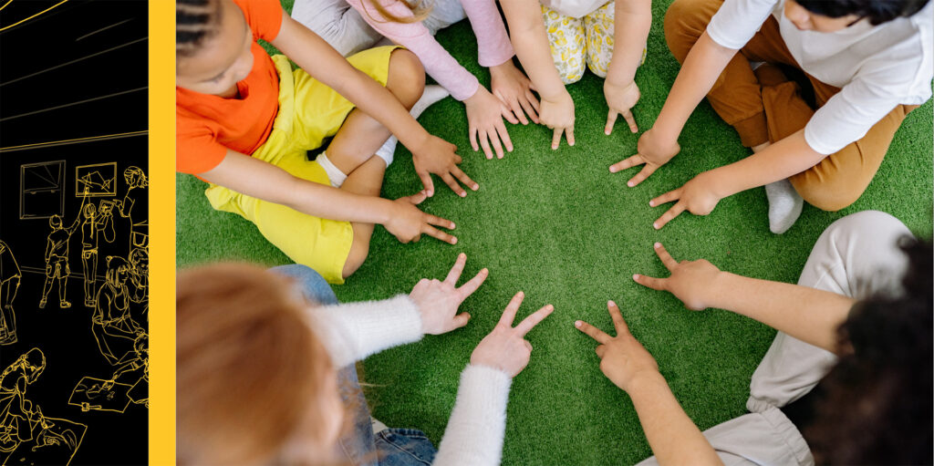 Top-down image of children sitting in a circle with their hands on the floor in front of them