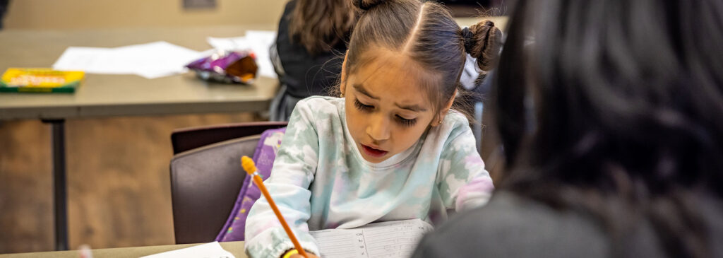 A student writing in her notebook