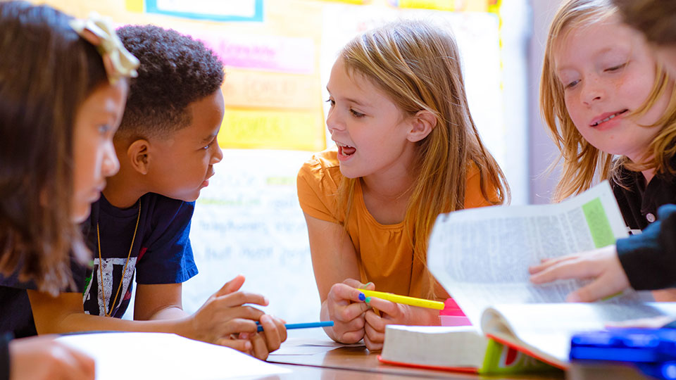 Students talking at a table