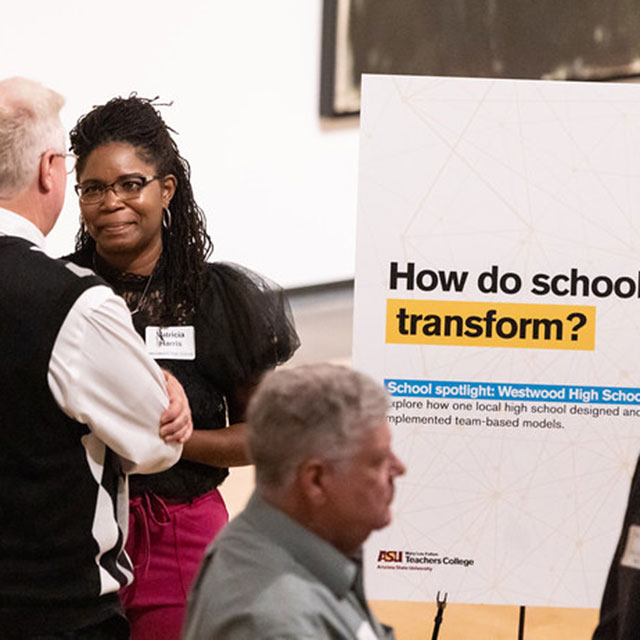 how-do-schools-transform People discussing things at an Explore Experience